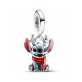 Charms Stitch con bufanda y cuernos rojos