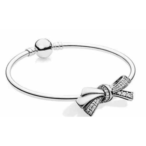 Pulsera de Plata con Dijes de Moño