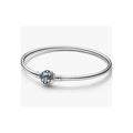 Pulsera rígida plateada con charm de flor y tipo zafiro azul